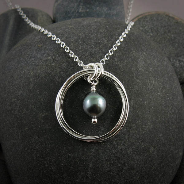 Silver love knot pendant with a Tahitian pearl