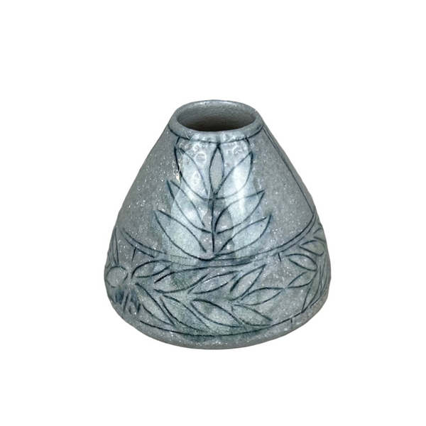 A conical ceramic bud vase with a salt glazed finish and blue incised patterns.