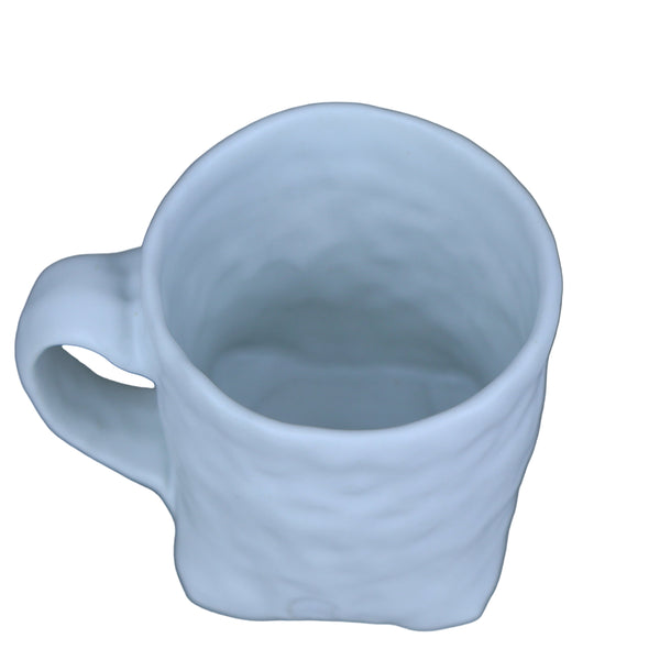 Hand built porcelain cup with folded base