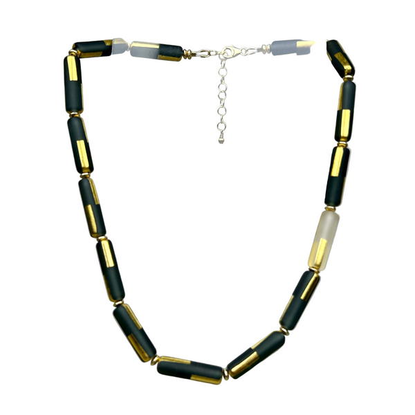 Black sandblasted glass necklace by Minori Takagi with 24K gold leaf detail and 14K gold filled chain, 18 inches long.