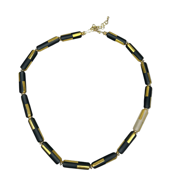 Black sandblasted glass necklace by Minori Takagi with 24K gold leaf detail and 14K gold filled chain, 18 inches long.