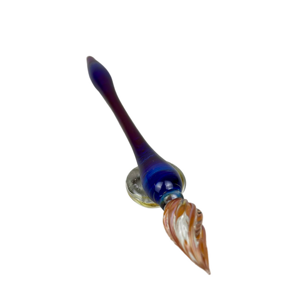 Handcrafted glass dip pen and tester pen set in swirling purple and gold tones, displayed together on a neutral background