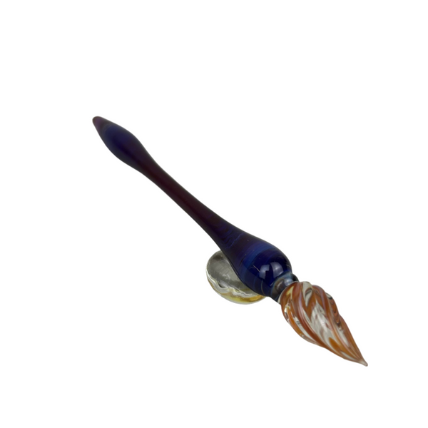 Handcrafted glass dip pen and tester pen set in swirling purple and gold tones, displayed together on a neutral background