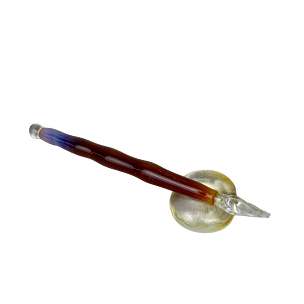 Handcrafted glass dip pen and tester pen set in swirling purple and gold tones, displayed together on a neutral background