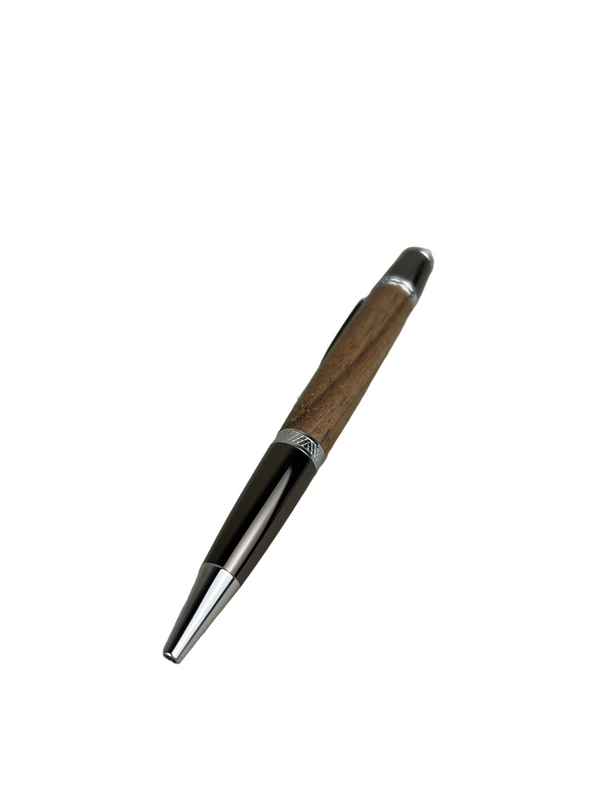 Twist ballpoint pen crafted from warm walnut wood with polished metal accents, displayed on a white background