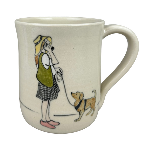 Ceramic mug with a design of a person walking a dog on a gray background