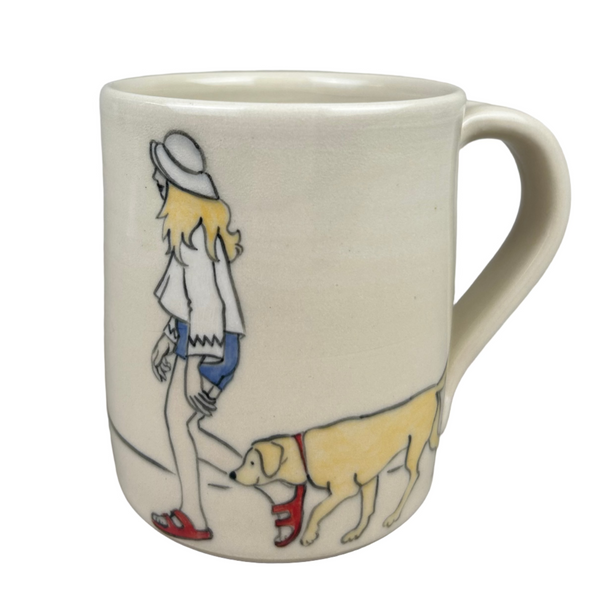 Mug with a design of a person walking a dog on a gray background