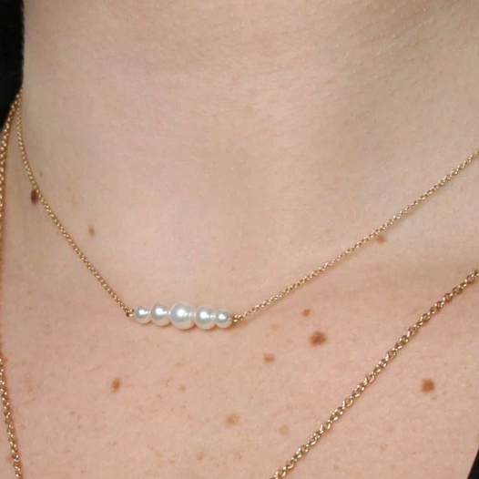 Surge gold sideways pendant