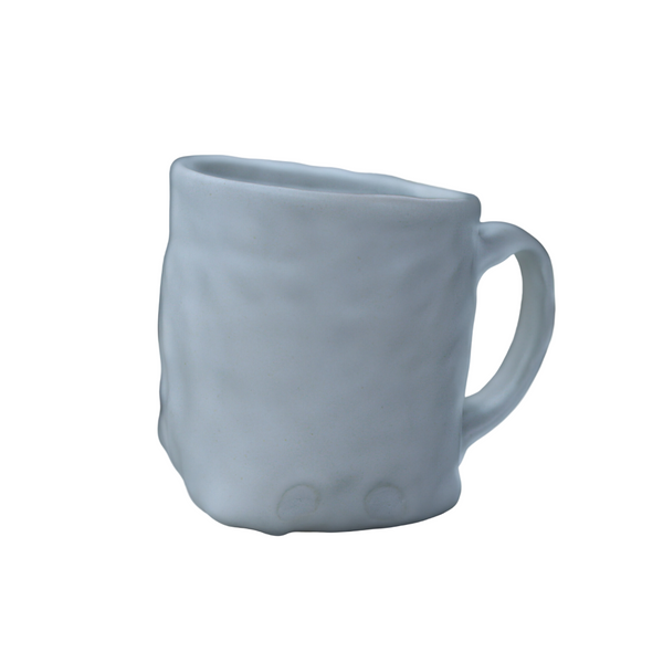 Hand built porcelain cup with folded base