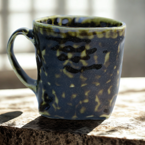 Hand built porcelain cup with folded base (brown)
