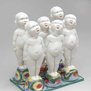 Set of ceramic figures on a gray background