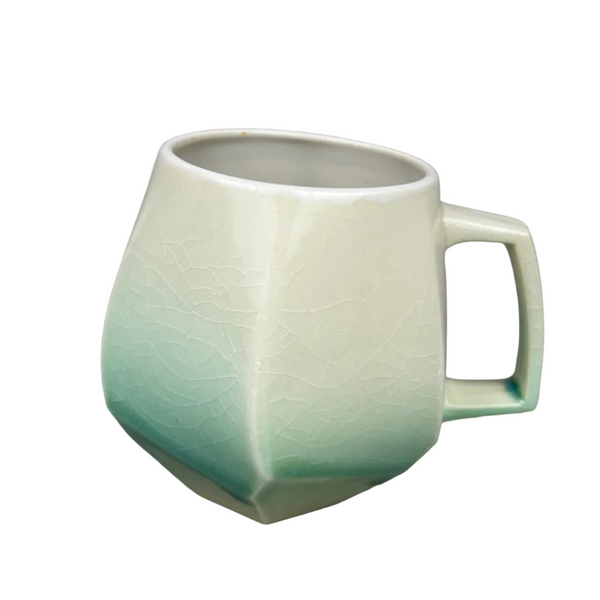 Green ceramic mug on a gray background