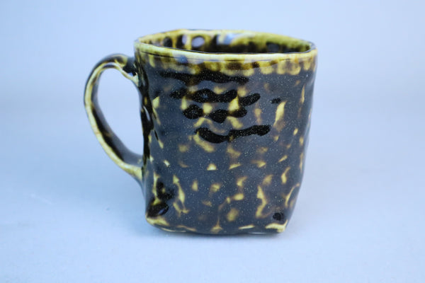 Hand built porcelain cup with folded base (brown)