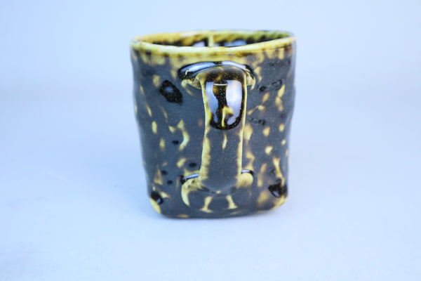 Hand built porcelain cup with folded base (brown)