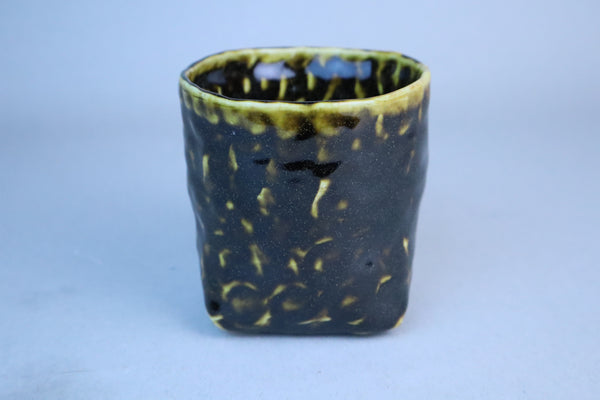 Hand built porcelain cup with folded base (brown)