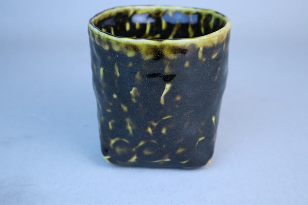 Hand built porcelain cup with folded base (brown)