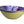 Ceramic bowl with purple interior and yellow exterior on a light gray background