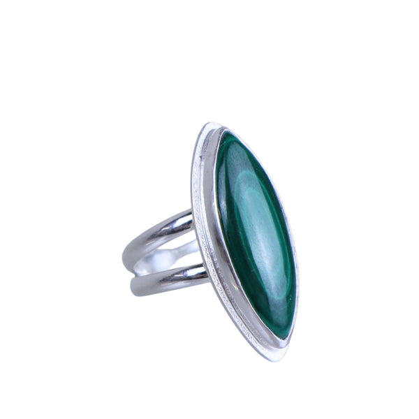 Silver ring with a green stone on a white background
