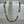 Black sandblasted glass necklace by Minori Takagi with 24K gold leaf detail and 14K gold filled chain, 18 inches long.