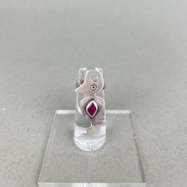 Sterling silver ring with organic hive-like design, featuring a natural ruby at the center.