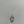 Silver necklace with a pendant featuring a green gemstone on a gray background