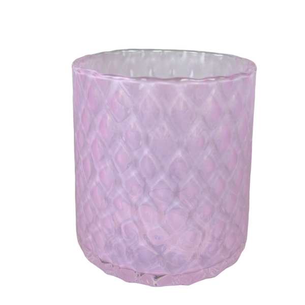 Pink textured glass  cup on a light gray background