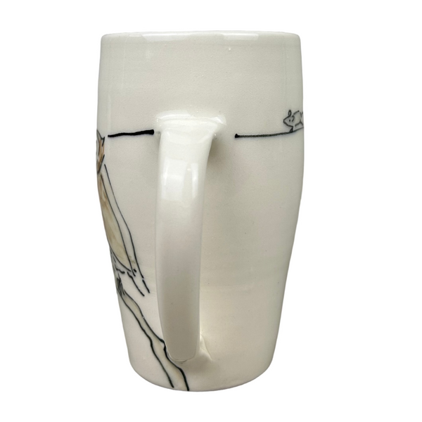 White mug with black abstract design on a gray background