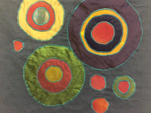 Colorful circular patterns on a textured surface