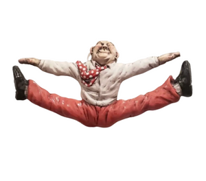 Figurine of a person in a split pose with a white background