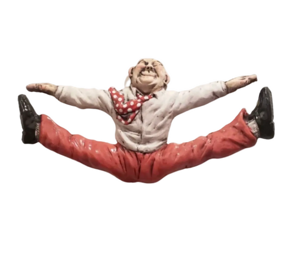 Figurine of a person in a split pose with a white background